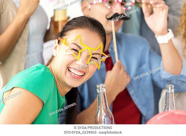 happy woman with friends having fun at party