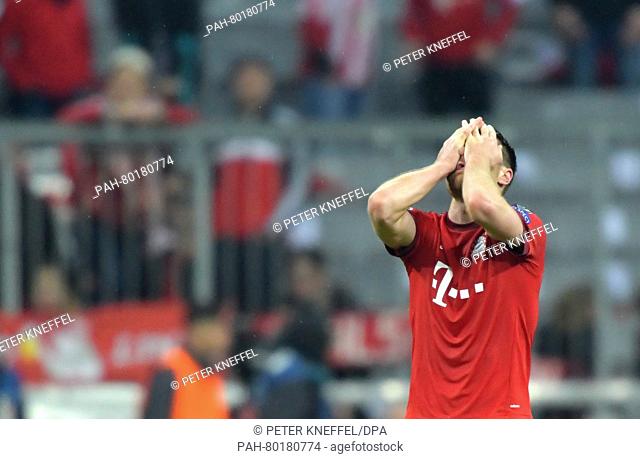 Munich's Xabi Alonso reacts after the UEFA Champions League semi final second leg soccer match between Bayern Munich and Atletico Madrid at the Allianz Arena in...