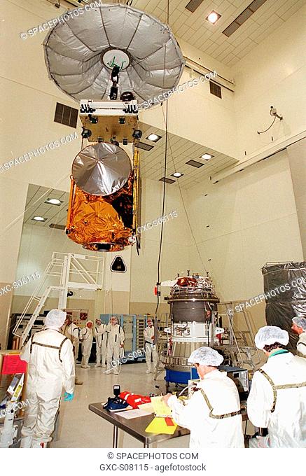 03/23/2001 --- In the Space Assembly and Encapsulation Facility 2, the suspended Mars Odyssey Orbiter approaches the third stage of a Delta rocket, at right