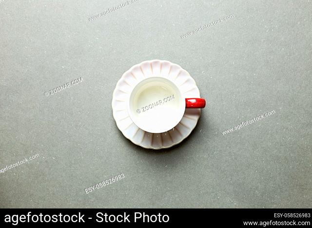 Empty coffee cup on gray background. top view