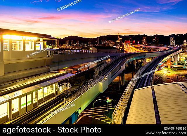 Sunset twilight monorail track and highway red bridge to Kobe downtown Hyogo Kansai Japan