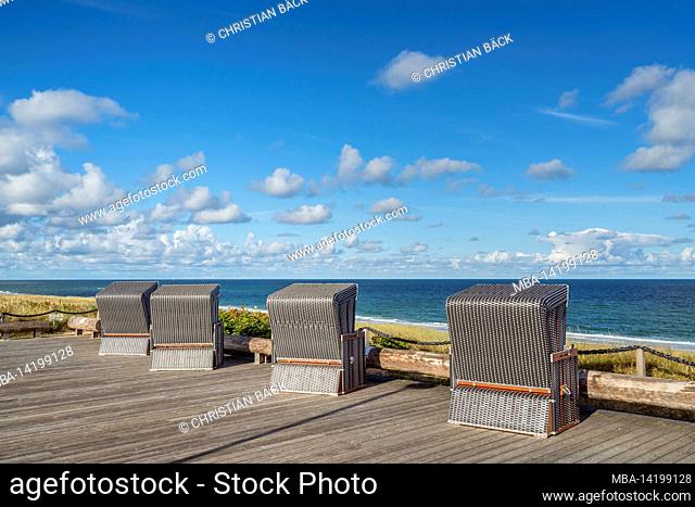 Beach chairs on the promenade above the sea, Wenningstedt, Sylt Island, Schleswig-Holstein, Germany