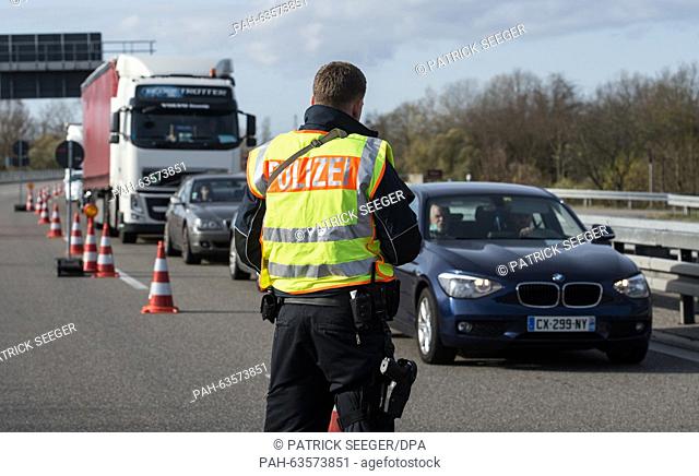German border police check vehicles on the A5 near Neuenburg, Germany, 14 November 2015. France has declared a state of emergency following a series of...