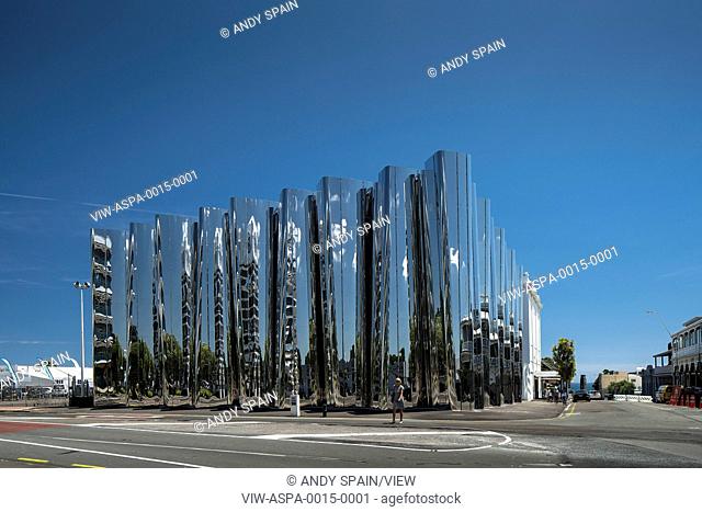 View across street towards polished building facade. Len Lye Centre, New Plymouth, New Zealand. Architect: Patttersons Associates, 2015