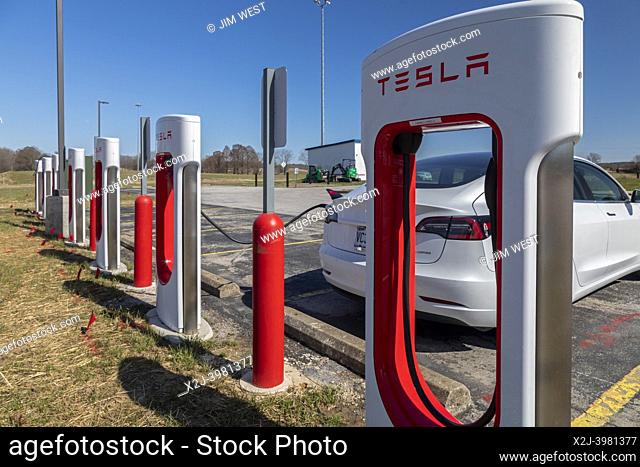 Beaver Dam, Kentucky - A car charges at a Tesla charging station in a rest area on the Western Kentucky Parkway