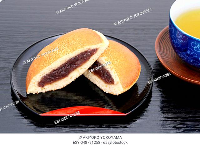 Dorayaki, Japanese confectionery on wooden tray, on black table