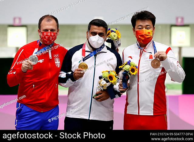 24 July 2021, Japan, Tokio: Shooting: Olympics, final, air pistol 10 m, men, at the Asaka Shooting Range. Javad Foroughi (M) from Iran cheers for gold