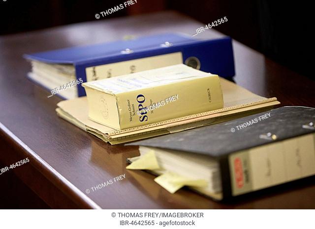 Trial files and Criminal Procedure Code StPO on the table in the courtroom, Koblenz District Court, Rhineland-Palatinate, Germany