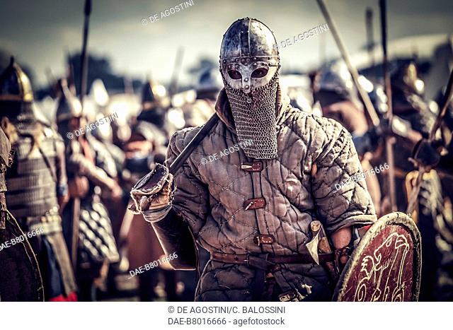 Warrior with helmet, chainmail, gambeson, sword and shield, Festival of Slavs and Vikings, Centre of Slavs and Vikings, Jomsborg-Vineta, Wolin island, Poland