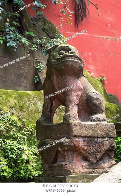 Carved stone dog at a monastery, Leshan, Sichuan province, China