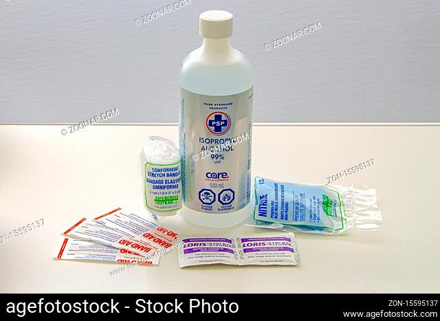 Calgary, Alberta, Canada. May 18, 2020. PSP isopropyl alcohol 99% USP Care with first aid kit items on a white table