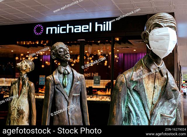 Melbourne, Australia - October 27, 2020: Bourke St and Swanston St in Melbourne and the famous 'Three Businessmen Who Brought Their Own Lunch' sculptures during...