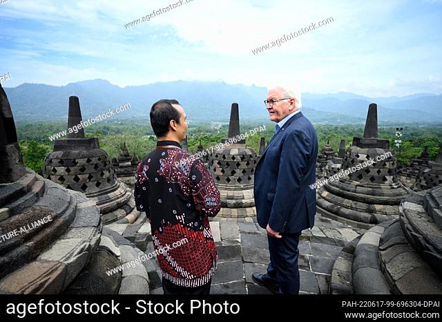 17 June 2022, Indonesia, Yogyakarta: German President Frank-Walter Steinmeier is guided through the Borobudur temple complex by Nahar Cahyan Daru (l)