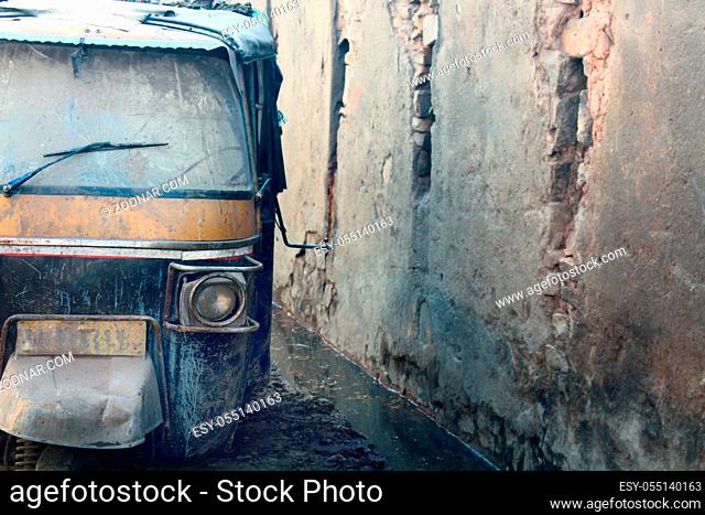old abandoned ricksha taxi tuk tuk. used non-working vehicles