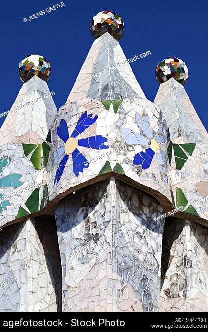 Brightly coloured ceramic tiles and glass decorate the flat roof chimneys of Casa Batllo, Barcelona, 1904-07
