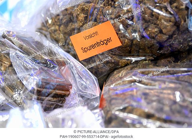 07 June 2019, Bavaria, Munich: Seized hashish and marijuana can be seen at a press conference of the Munich police. At the press conference