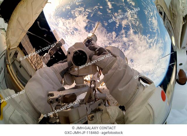 Expedition 33 Flight Engineer Akihiko Hoshide takes a picture of his helmet visor while participating in a 6-hour, 38-minute spacewalk outside the International...