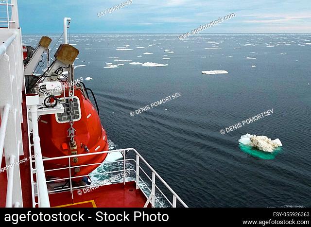 The feed of a ship sailing in the Arctic. Landscape of the Arctic from the deck of the tanker