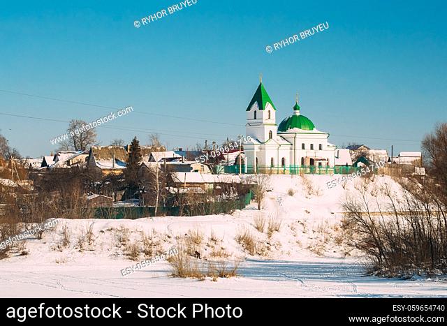 Gomel, Belarus. Church Of St Nicholas The Wonderworker And Frozen Sozh River In Sunny Winter Day. Orthodox Church Of St. Nikolay Chudotvorets