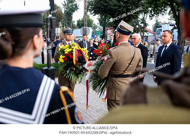 01 September 2019, Poland, Wielun: Federal President Frank-Walter Steinmeier and Polish President Andrzej Duda lay flower arrangements at the memorial ceremony...