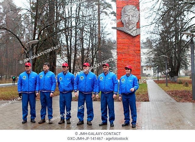 With the statue of Vladimir Lenin nearby, the Expedition 4243 backup and prime crewmembers pose for pictures Nov. 11 at the Gagarin Cosmonaut Training Center in...
