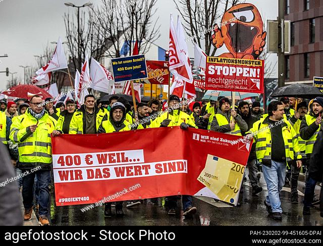 02 February 2023, North Rhine-Westphalia, Dortmund: During a one-day warning strike, Coca-Cola employees lend weight to their demands with a demonstration march