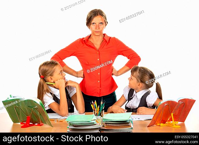 Children look at an evil teacher