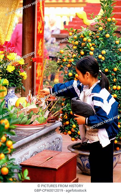 Vietnam: Tet (Vietnamese New Year) celebrants at Tran Quoc Pagoda, Ho Tay (West Lake), Hanoi