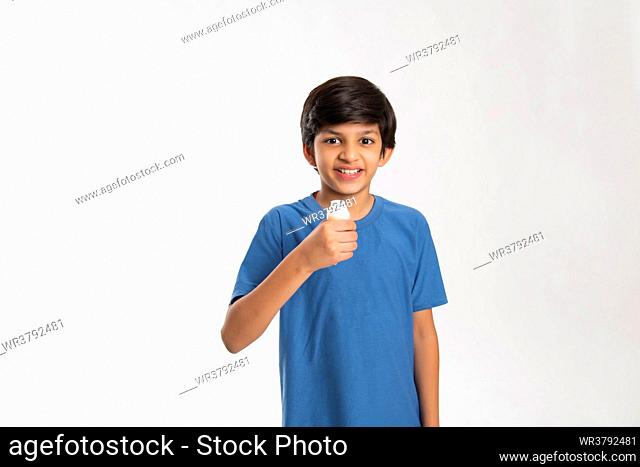 Portrait of a boy drinking flavored milk during breakfast