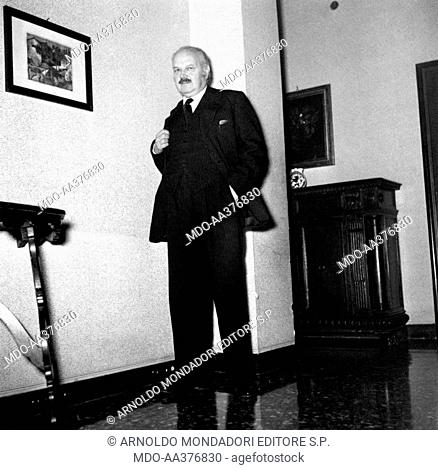 Antonio Baldini posing. Italian writer and journalist Antonio Baldini posing in a house. 1955