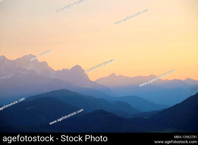 View of the Wetterstein Mountains with Alpspitze, Zugspitze, Waxenstein, in the middle the Ammergau Alps with the Daniel, sunset, Isar Valley, Upper Bavaria