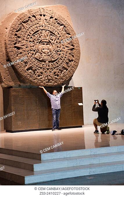 Tourists in front of the Calendario Azteca or Piedra del Sol at the Museo Nacional de Antropologia-The National Museum of Anthropology, Ciudad de Mexico
