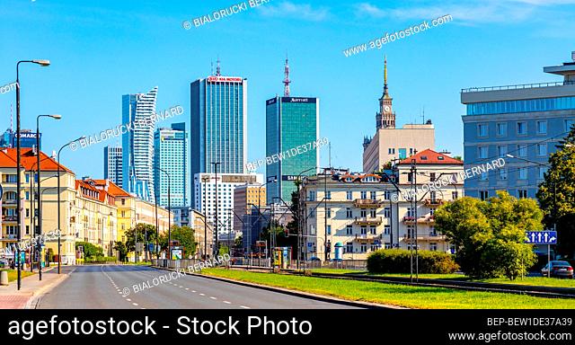 Warsaw, Poland - July 26, 2020: Srodmiescie city center district along Niepodleglosci avenue with Marriott Hotel, Chalubinskiego tower and downtown skyscrapers