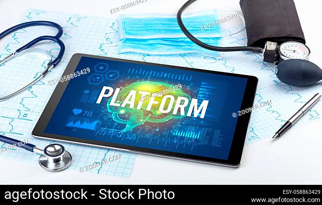 Tablet pc and medical tools with PLATFORM inscription, social distancing concept