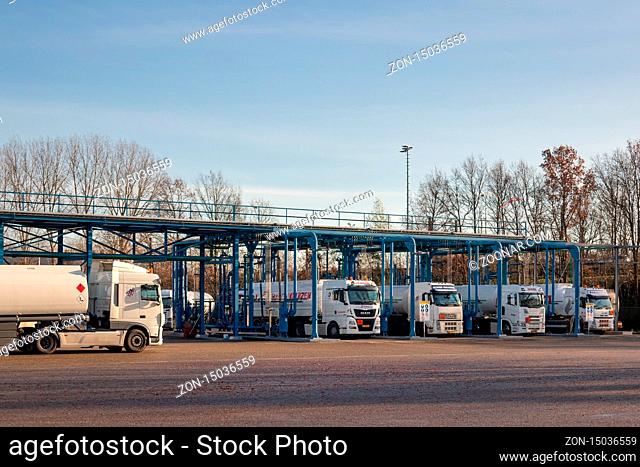 Utrecht, The Netherlands - December 12, 2019: Oil tankers loading oil and gas at transfer station near Utrecht