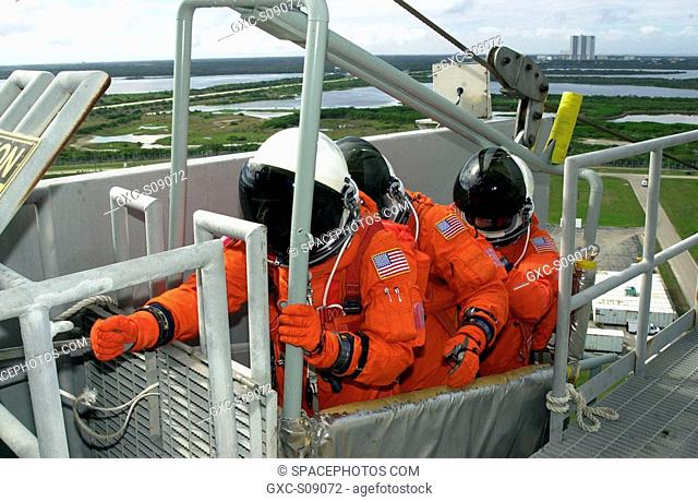 02/01/2002 -- As part of Terminal Countdown Demonstration Test activities, the STS-109 crew practices emergency exit from the Shuttle