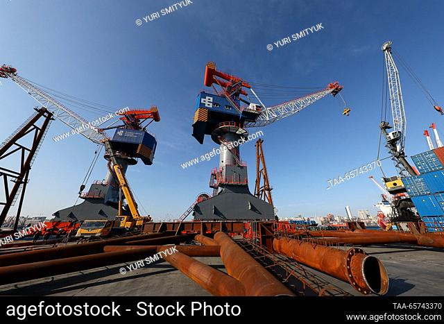 RUSSIA, VLADIVOSTOK - DECEMBER 14, 2023: Cranes are seen at the Vladivostok Sea Fishing Port on Russia's Pacific coast. The port offers services for...