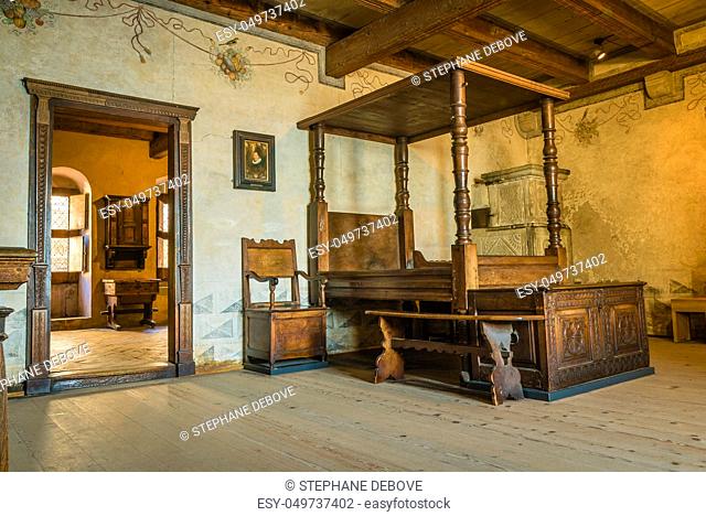 A wooden bed and bedroom from the Middle Ages in a castle