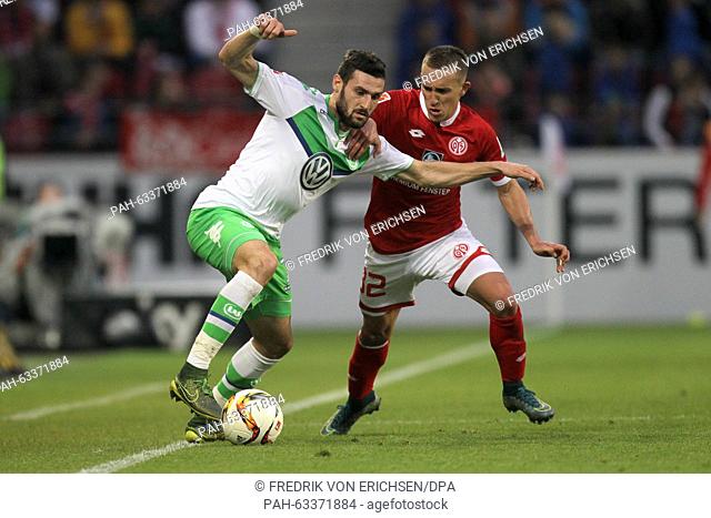 Mainz' Pablo de Blasis (R) in action against Wolfsburg's Daniel Caligiuri during the German Bundesliga soccer match between 1
