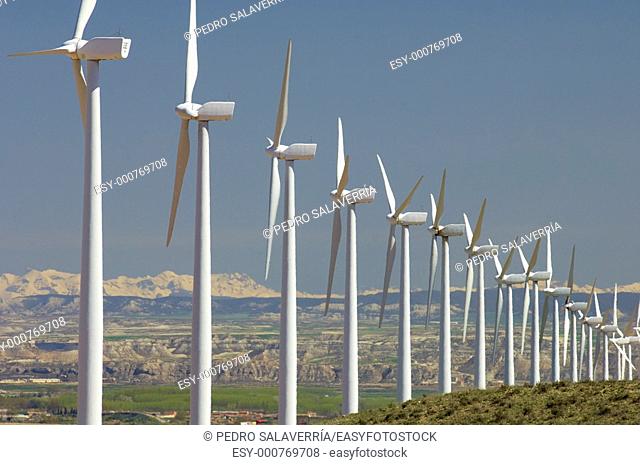 group of aligned windmills in Pozuelo de Aragon, Saragossa, Aragon, Spain