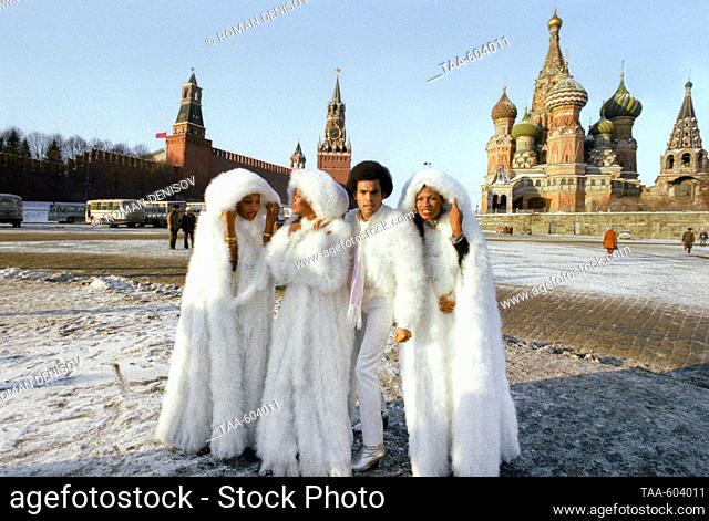 Moscow, USSR. Boney M. vocal disco-group members Maizie Williams, Liz Mitchell, Bobby Farrell and Marcia Barrett (L-R) pose for a photo in Vasilyevskaya Square