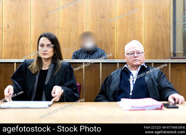 21 December 2022, Lower Saxony, Hanover: The defendant (M) sits in a courtroom at the Hanover Regional Court before the trial begins