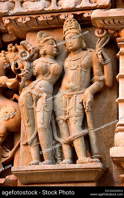 Stone sculpture of divine couple at Parshwanath Jain Temple in Khajuraho, Madhya Pradesh, India, Asia