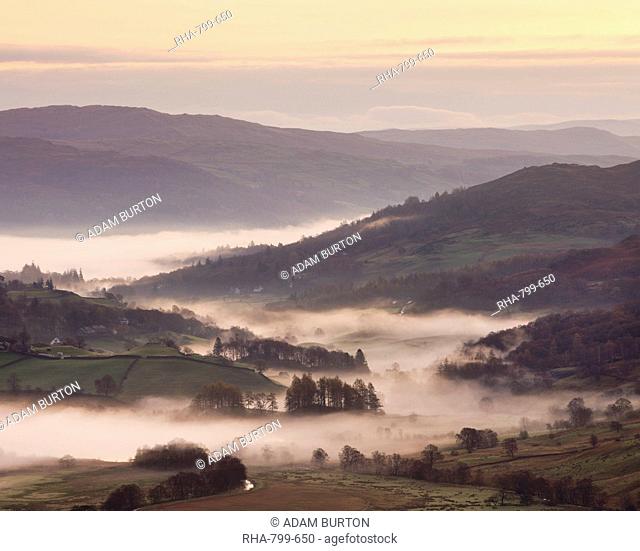 Mist lingers in the Little Langdale valley at dawn, Lake District National Park, Cumbria, England, United Kingdom, Europe