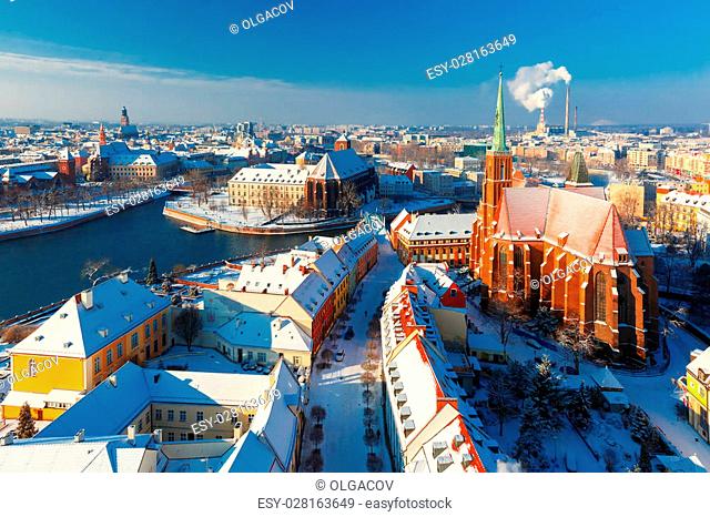 Aerial view of Old Town and Ostrow Tumski with church of the Holy Cross and St. Bartholomew from Cathedral of St. John in the winter morning in Wroclaw, Poland