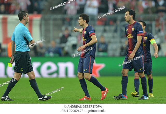 Barcelona's players talk to the referee during the UEFA Champions League semi final first leg soccer match between FC Bayern Munich and FC Barcelona at the...