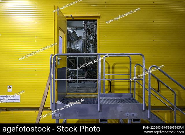 03 June 2022, Saxony, Leipzig: A door stands open in the enclosure of the second gas turbine on the construction site of the gas-fired power plant of Leipziger...