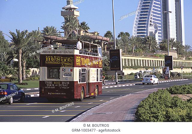 The Big Bus Company tour bus near Jumeirah Beach hotel and Wild Wadi Water park in Dubai, UAE