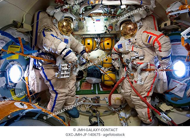 Unoccupied Russian Orlan spacesuits for Russian cosmonauts Oleg Artemyev (blue stripes) and Alexander Skvortsov (red stripes)