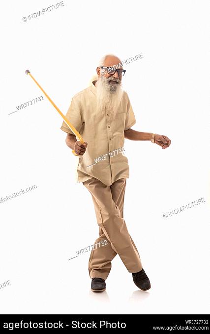 A HAPPY OLD MAN PLAYFULLY DANCING IN FRONT OF CAMERA